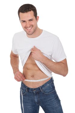 man measuring waist